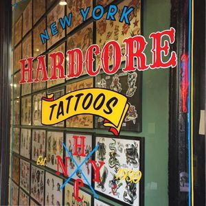 The front door of New York Hardcore Tattoo, painted by Tina Fino (IG—tina_fino). #NewYorkHardcoreTattoo #signpainting #tattooinspired #TinaFino