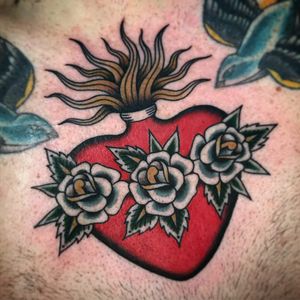 Sacred heart tattoo by Andrea Giulimondi #andreagiulimondi #hearttattoos #color #traditional #heart #sacredheart #rose #roses #flowers #floral #leaves #nature #fire #love