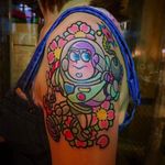 Buzz lightyear and blossoms tattoo by @pikkapimingchen #cartoon #cartoonstyle #neotraditional #bright_and_bold #toystory #buzzlightyear #disney #disneymovie #DisneyPixar #Pixar