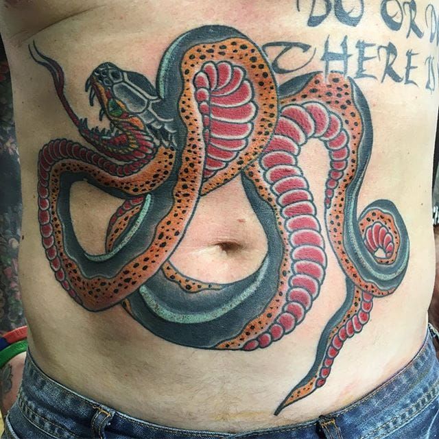 Hand poked snake tattoo on the stomach