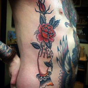 Traditional hand and rose by Nick Rutherford. #traditional #NickRutherford #tattooflash #hand #rose #flower