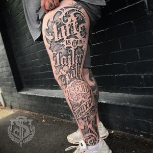 Insane lettering tattoo by Sam Taylor #SamTaylor #letteringtattoos #script #text #quote #font #gothic #oldenglish #legsleeve #silhouette #filigree #leaves #banner #death #life #freedom