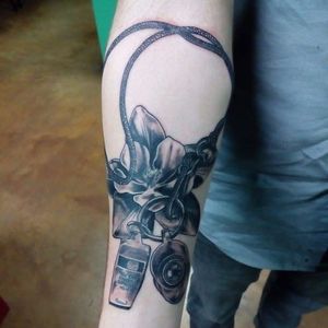 Black and grey whistle and columbine flower tattoo by Craig Killing. #flower #floral #columbine #columbineflower #whistle #CraigKilling