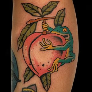 Froggy loves the peaches. Tattoo by Alex Zampirri #AZamp #AlexZampirri #peachtattoos #color #traditional #frog #Amphibian #animal #peach #fruit #food #leaves #nature #cute