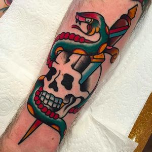 Classic and solid snake dagger and skull tattoo done by Simon Blay. #SimonBlay #TLCtattoo #TraditionalLondonClan #boldtattoos #snake #skull #dagger
