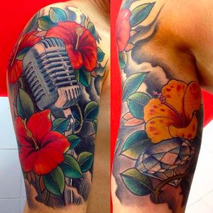 Beautiful looking microphone tattoos with some hibiscus flowers. Tattoo done by Rafa Serrano. #RafaSerrano #LTWtattoo #neotraditional #coloredtattoo #hibiscus #microphone