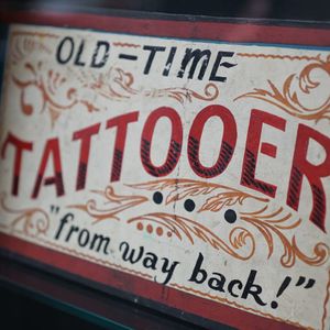 Old Time Tattooer sign from the Daredevil Museum (photo by Katie Diamond) #milliehull #history #NYC #daredeviltattoo #museum