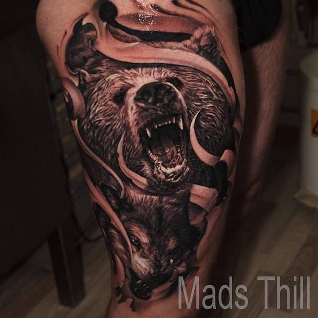 Tattoo uploaded by Stacie Mayer • Wolf and bear decorative ripped skin  tattoo by Mads Thill. #blackandgrey #realism #wolf #bear #rippedskin  #decorative #MadsThill • Tattoodo