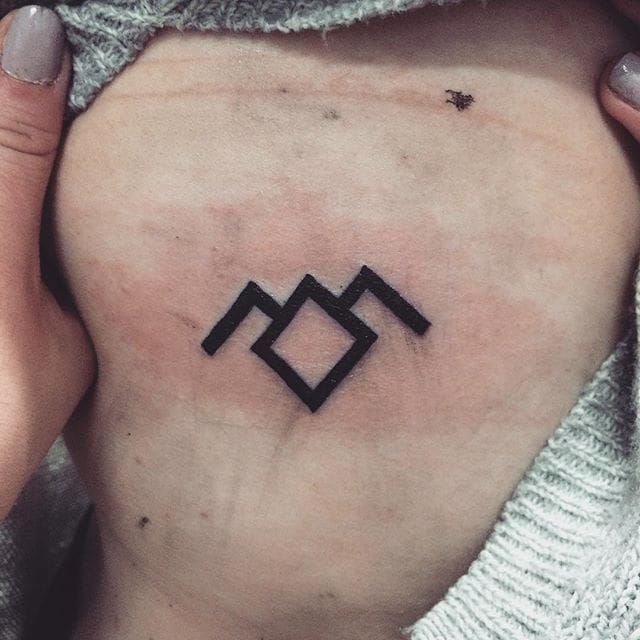 My tiny Twin Peaks tattoo! I had always wanted the Owl Cave symbol, so I  finally got it tattooed.