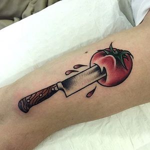 Knife and tomato tattoo by @sanghotattoo. #tomato #knife #fruit #vegetable #sanghotattoo