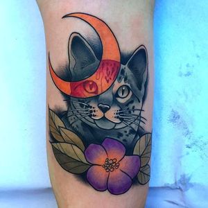 Really rad cat tattoo with the crescent moon. Awesome work by Kike Esteras. #KikeEsteras #cat #blossom #crescent #moon #neotraditional #animaltattoo