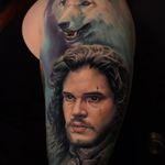 Game of Thrones tattoo by Evan Olin #EvanOlin #colortattoo #realismtattoo #realistictattoo #hyperrealismtattoo #portraittattoo #gameofthronestattoo #tvtattoo #jonsnowtattoo #wolftattoo #tattoooftheday 