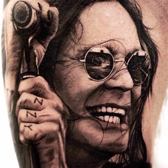 Black and grey Ozzy Osbourne portrait tattoo done on