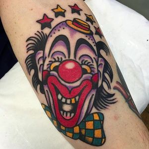 Awesome looking clown head tattoo done by Fergus Simms. #FergusSimms #MelbourneTattooCompany #traditionaltattoo #boldtattoos #clown