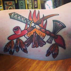Peace Pipe Tattoo, artist unknown #peacepipe #pipe #smoke #feathers #fire #NativeAmericaTattoo #traditional