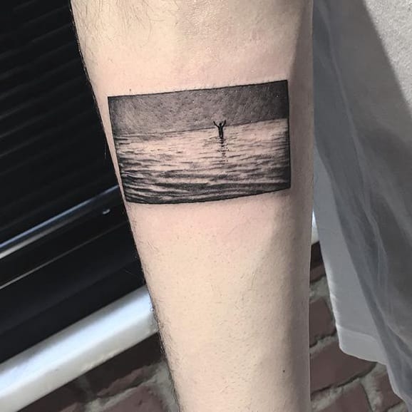 Tattoo swimming in ocean