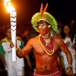 Rio 2016 Torchbearer Raoni Vieira, photo by Andre Mourao via Rio2016 #torch #torchtattoo #flame #light #Rio2016 #indigenousculture #Indigenous #Brazil