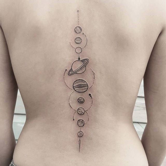 Cosmonaut and planets tattoo on back  Tattoo Designs for Women
