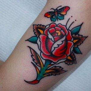 Classic and solid rose with butterfly. Tattoo by CP Martin. #CPMartin #thedarlingparlour #sydney #traditionaltattoos #rose #butterfly
