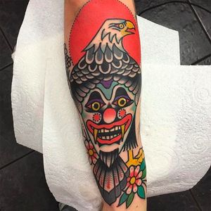 Eagle and clown tattoo by Teide Tattoo #TeideTattoo #SevenDoorsTattoo #Neotraditional #Eccentric #AnimalTattoos #Eagle #Clown