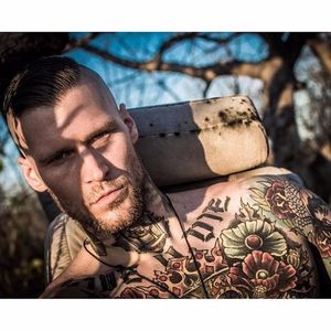 Marshall knows how to charm the camera Photo by The 8th Class #MarshallPerrin #tattoomodel #tattooedguys #firefighter #traditionaltattoo #The8thClass #tattoododudes