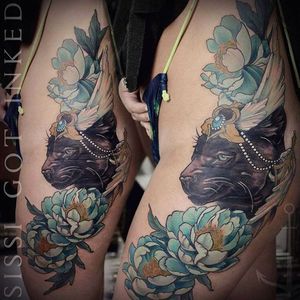 Clean side tattoo of a cat and some peonies, great tattoo done by Konstanze K. #KonstanzeK #illustrativetattoos #panther #peony #floral