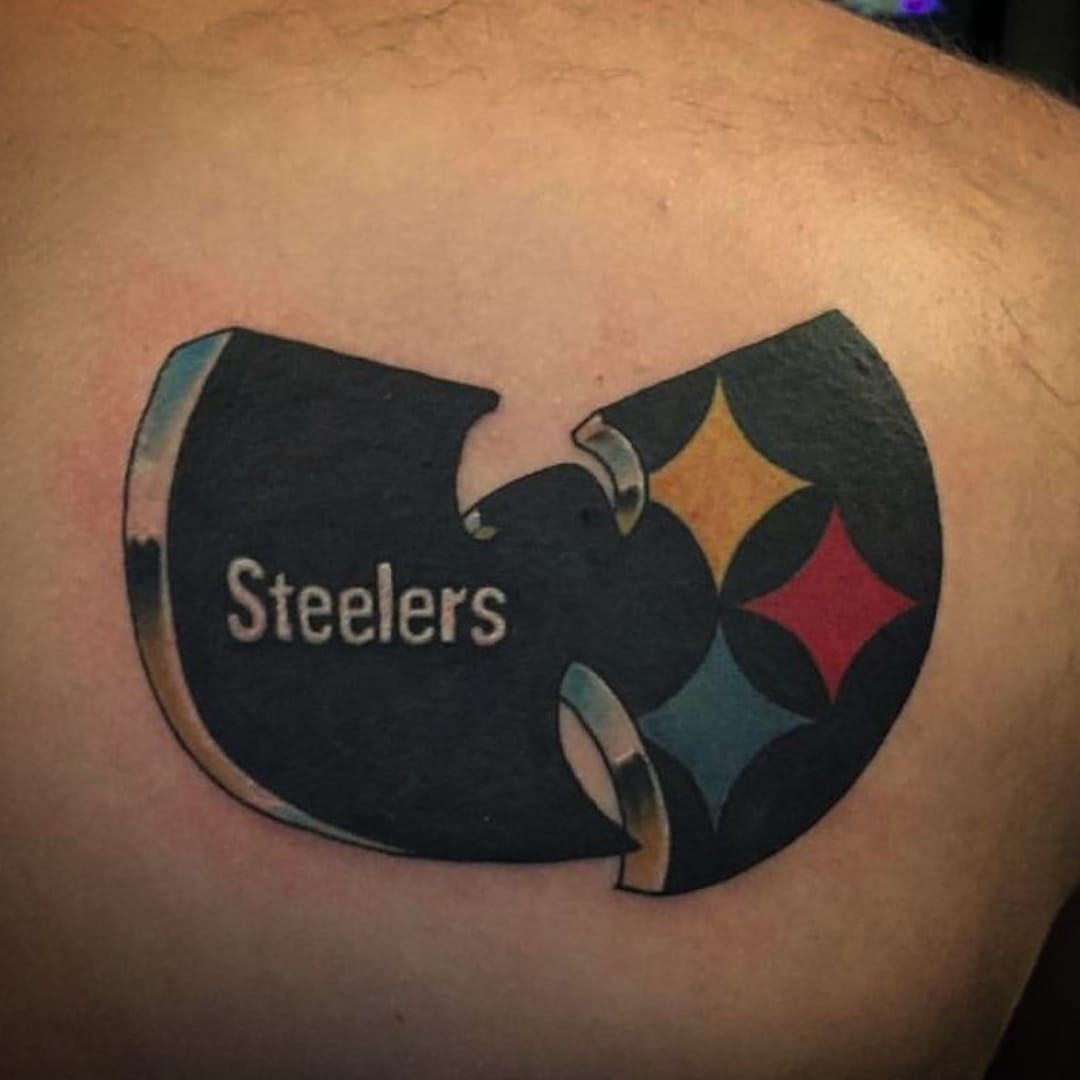 Pittsburgh Steelers fans shows off his tattoos and his spirit in the fourth  quarter of the Pittsburgh Steelers win against the Baltimore Ravens on  December 25 2016 The 3127 win over the