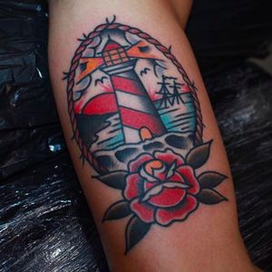 A lighthouse above a nautical rose by CP Martin (IG—cpmartintattoo). #CPMartin #lighthouse #rose #seascape #traditional
