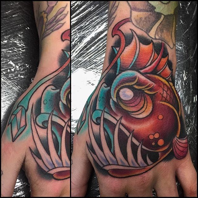 Neotraditional anglerfish tattoo on the thigh
