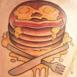 Pancake version of the skull and crossbones. Tattoo by Sean Campbell. #neotraditional #pancakes #bacon #cutlery #knife #fork #SeanCampbell