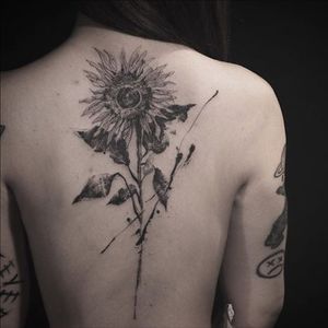 A beautiful sunflower with freeform accents by Nadi (IG—tattooer_nadi). #abstract #blackwork #freeform #illustrative #Nadi #sunflower
