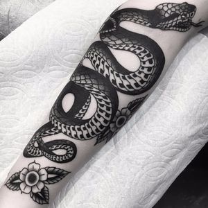 Slithering snake by Griffen Gurzi #GriffenGurzi #blackwork #traditional #snake #reptile #flower #leaves #nature #wildlife #tattoooftheday
