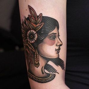 Beautiful and glean girl head tattoo done by Ibi Rothe. #IbiRothe #traditionaltattoo #boldtattoos #girlhead