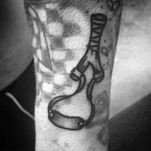 Nostalgic slingshot tattoo done by Kyle Lifetime. #KyleLifetime #blacktattoos #traditionaltattoo #slingshot #blackwork #traditional