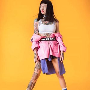 Lily Cash in Versace and Diesel. (Photo courtesy of Marie Claire.) #LilyCash #tattooartist #fashion #tattooedwomen #streetwear #hongkong #tattooapprentice #model #tattooedmodel