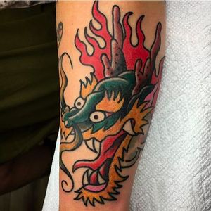 Beautiful and solid dragon head tattoo by Aldo Rodriguez. #AldoRodriguez #GrandUnionTattoo #traditionaltattoo #boldtattoos #dragon #flames