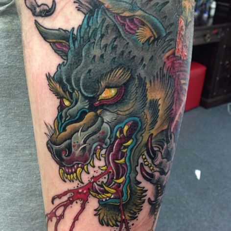 Tatuaje de lobo por Pommie Paul