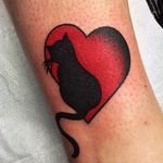 A simple traditional tattoo to express your love for cats. Tattoo by Chris Jenko. #traditional #heart #silhouette #cat #feline #love #ChrisJenko