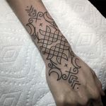 Ornamentalism tattoo by Johno #Johno #besttattoos #linework #blackwork #dotwork #tribal #geometric #ornamental #minimal #wristband #moon #floral #pattern #tattoooftheday