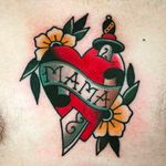 "MAMA" - Beautiful and classic heart tattoo with a sword and couple of blossoms. Tattoo by Moira Ramone. #MoiraRamone #25toLife #traditionaltattoo #blossoms #heart #sword