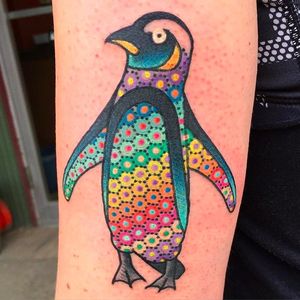 Radical looking penguin tattoo. Solid with that awesome color detail on its belly! Tattoo by Tomas Garcia. #tomasgarcia #penguin #dotwork #colored #traditional