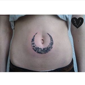 Floral crescent moon around navel tattoo by Vlada Shevchenko. #VladaShevchenko #blackwork #feminine #women #floral #flower #crescent #moon #bellybutton #navel