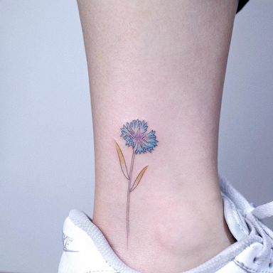 Cute flower by Tattooist Arar #TattooistArar #watercolortattoos #color #painterly #watercolor #flower #floral #nature #plant #leaves #minimal #small #fineline #illustrative