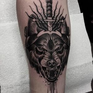 Fierce wolf and dagger tattoo by @Neil_Dransfield_Tattoo #NeilDransfieldTattoo #Black #Blackwork #Blackworkers #DarkTattoos #DarkArtists #Dagger #Wolf #NeilDransfield