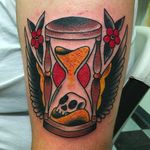 Time flies, beautiful and meaningful winged hour glass tattoo done by Janitor Jake. #JanitorJake #HatCityTattoo #traditional #boldtattoos #hourglass #wings #skull