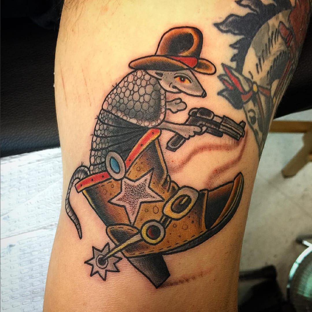 Traditional style armadillo tattoo located on the inner