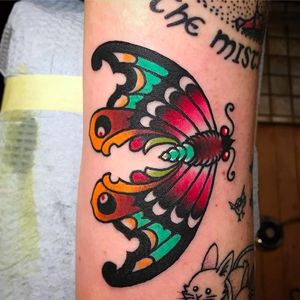 Solid and vibrant butterfly tattoo done by Paul Nycz. #PaulNycz #traditional #neotraditionaltattoo #coloredtattoo #butterfly