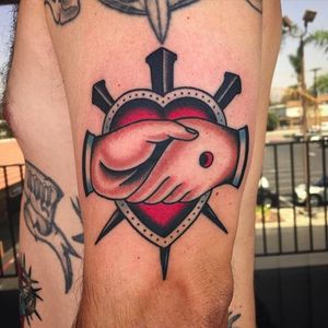 Heart, nails and handshake traditional tattoo by @jacobdoneytattoo #jacobdoneytattoo #traditional #traditionaltattoo #envisiontattoostudio #handshake #heart #nail