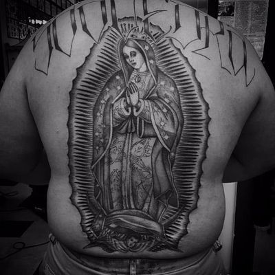 Sick back piece by Chuco Moreno #ChucoMoreno #oldschool #blackandgrey #religious #christian #VirginMary #Madonna #OurLadyOfGuadalupe #light #crown #prayer #angel #cherub #text #font #tattoooftheday
