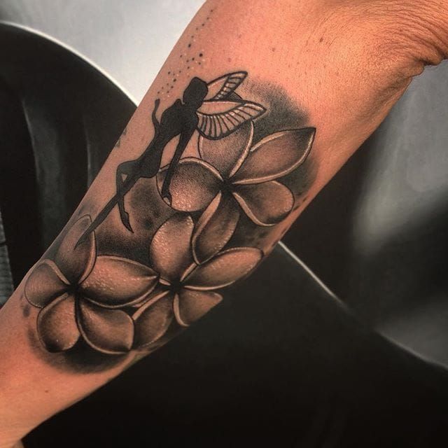 Pin by Melissa Lee on Tattoo designs in 2023  Plumeria tattoo Wrist  tattoos for guys Flower tattoos
